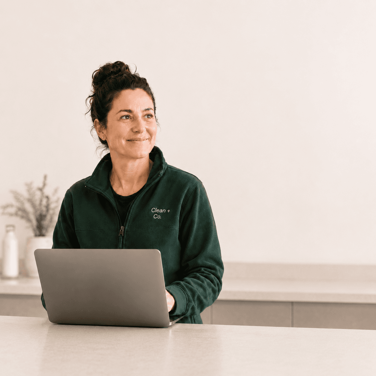 Cleaning business operator at her laptop